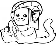 cute monkey in a turban with banana